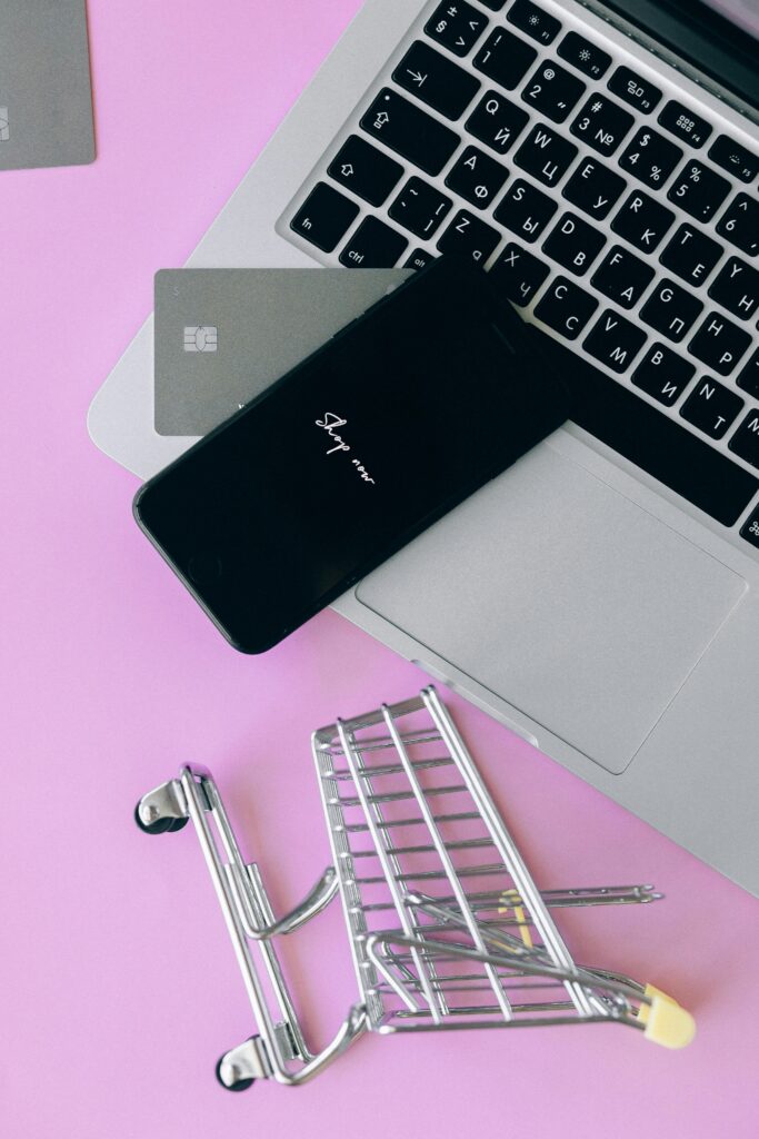 person shopping online credit card in frame on macbook m4